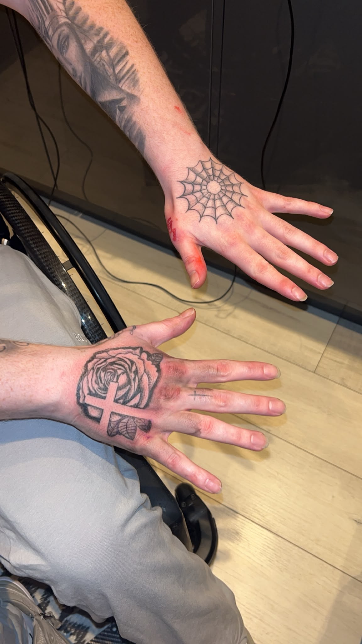 Spiderweb and rose hand tattoos