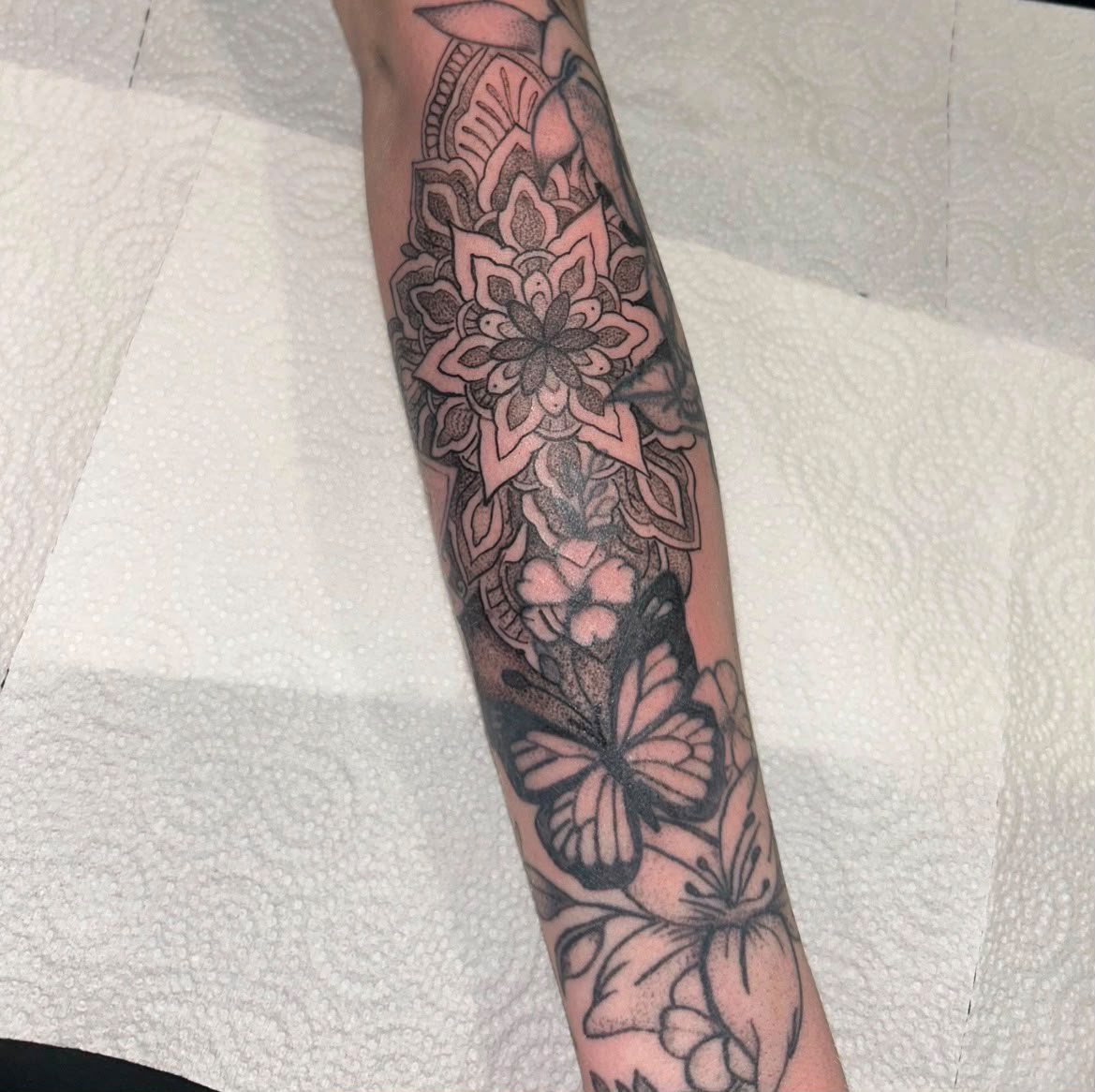 Mandala, floral and butterfly sleeve tattoo