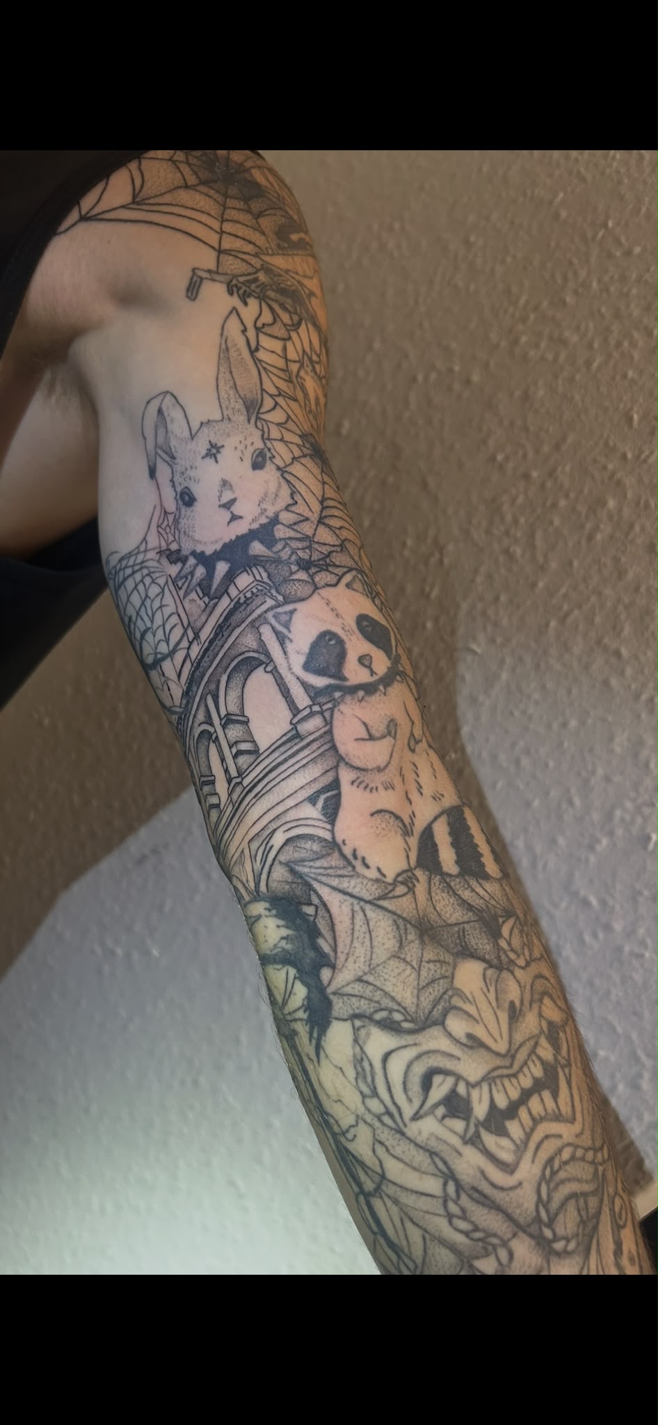 Detailed blackwork tattoo sleeve by Ollie