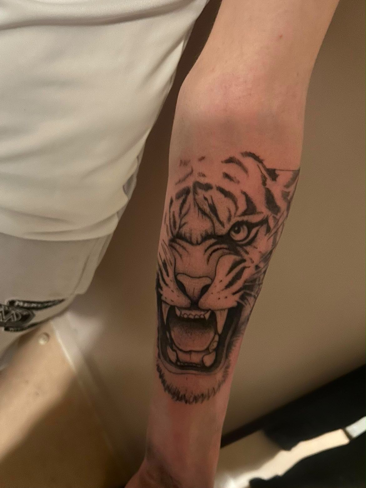 Black and grey roaring tiger tattoo